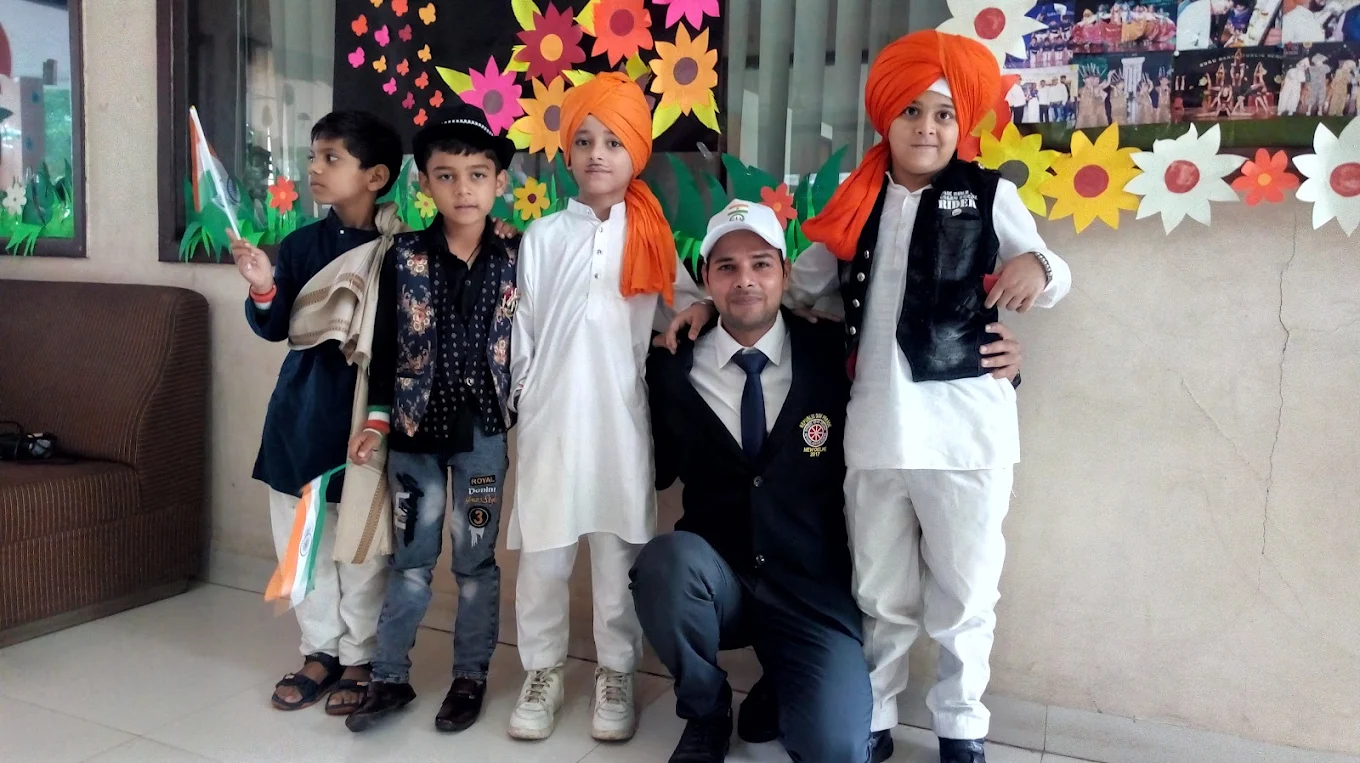 Young students in costume with a teacher during a school activity